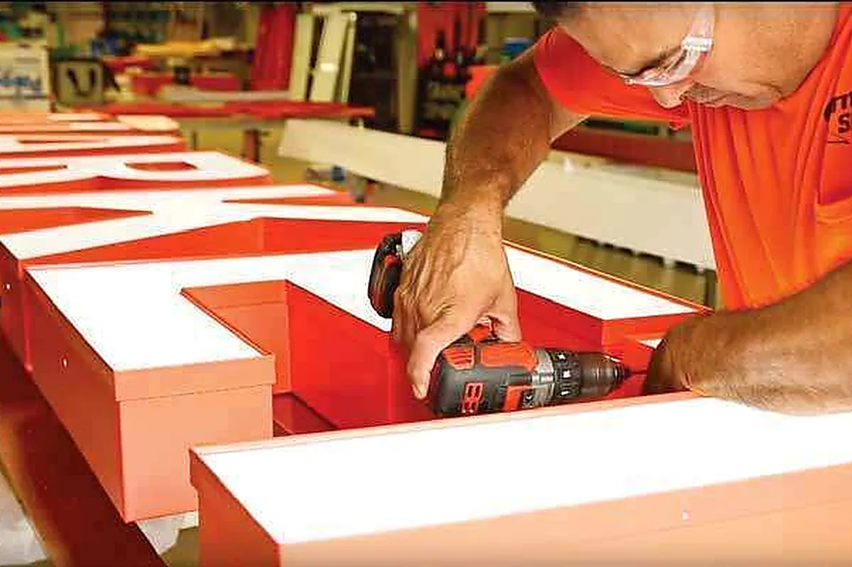 Fabrication of illuminated channel letters in the Brand Visual Advertising workshop